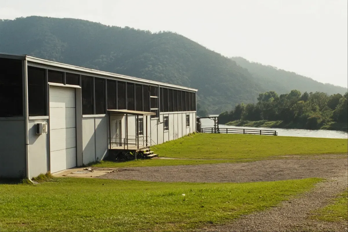Steel-frame shop house on cleared acres above the river outside Gadsden in Etowah County, Alabama