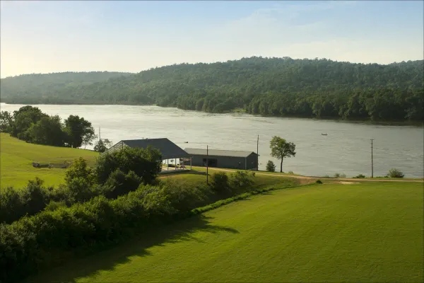 Metal post-frame home above river bottom farmland south of Decatur in Morgan County, Alabama